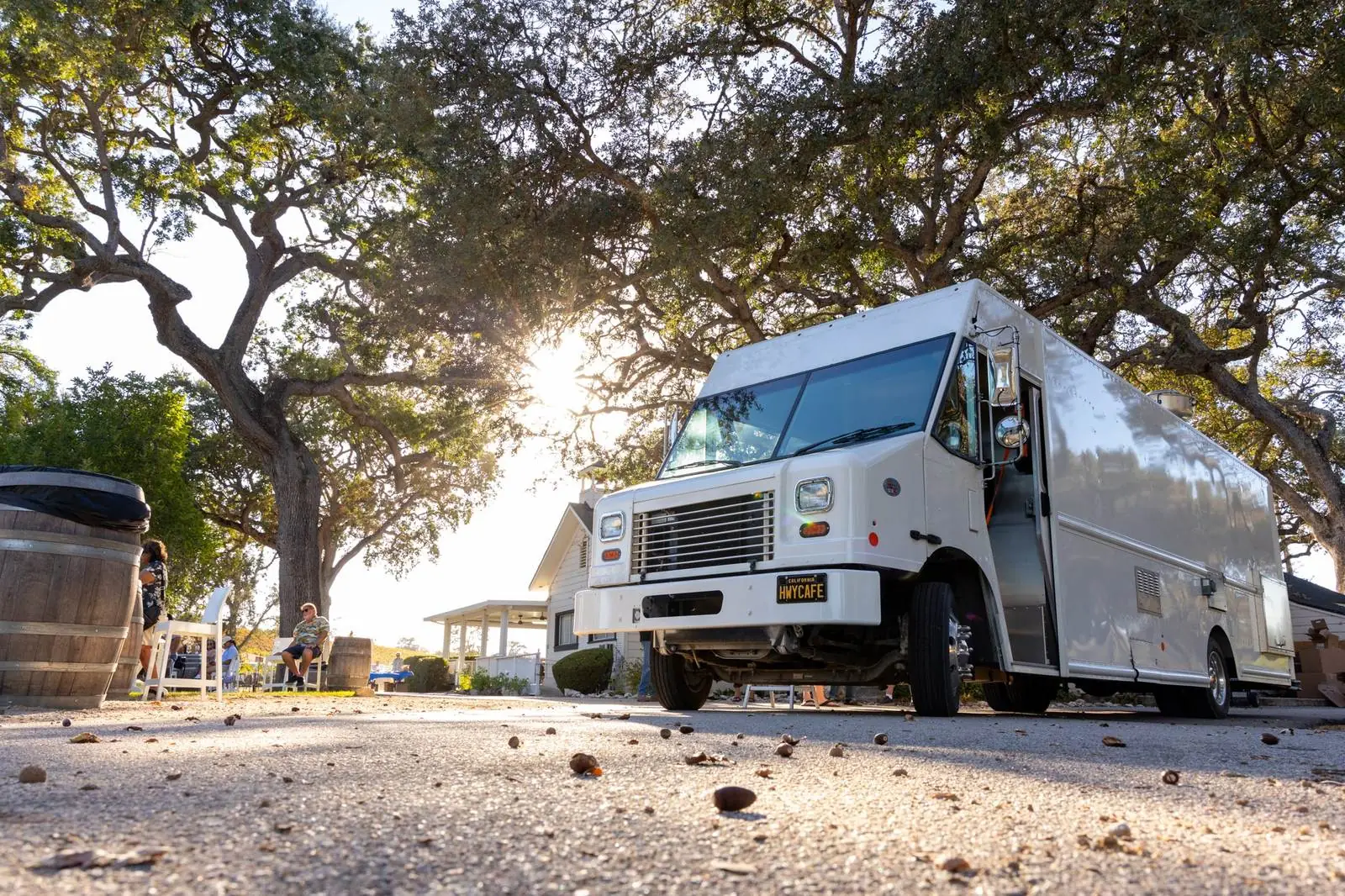 HWYCAFE food truck in golden-hour light under the oaks at Peachy Canyon Winery